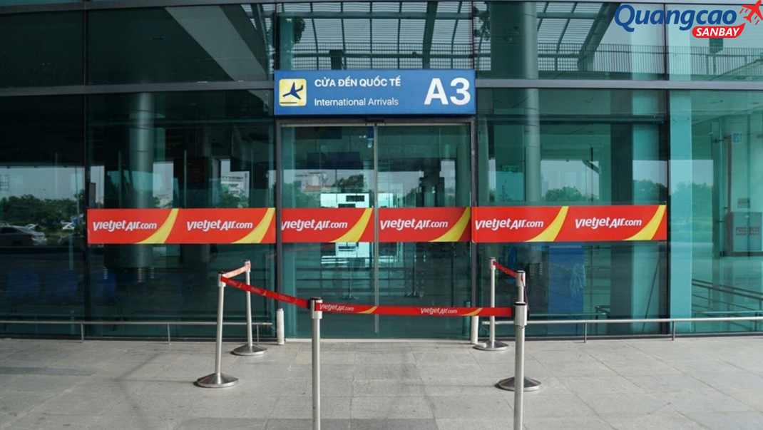 Decal advertising on the glass door of the entrance to the check-in area